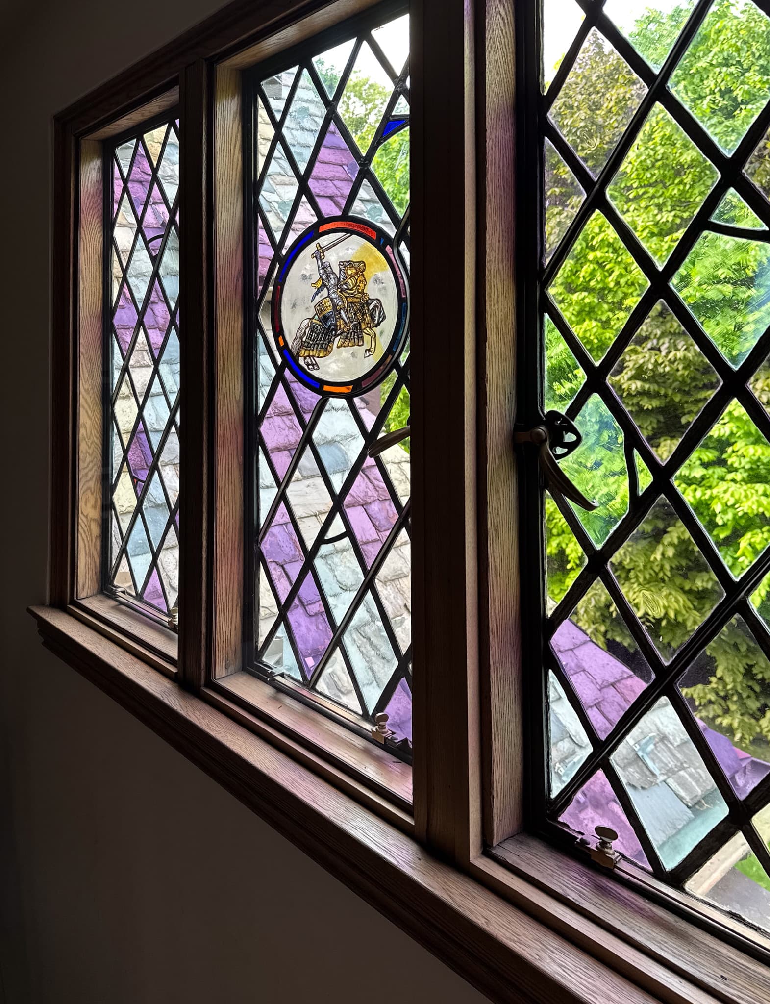 Whisper Windows insert protecting a historic stained glass window